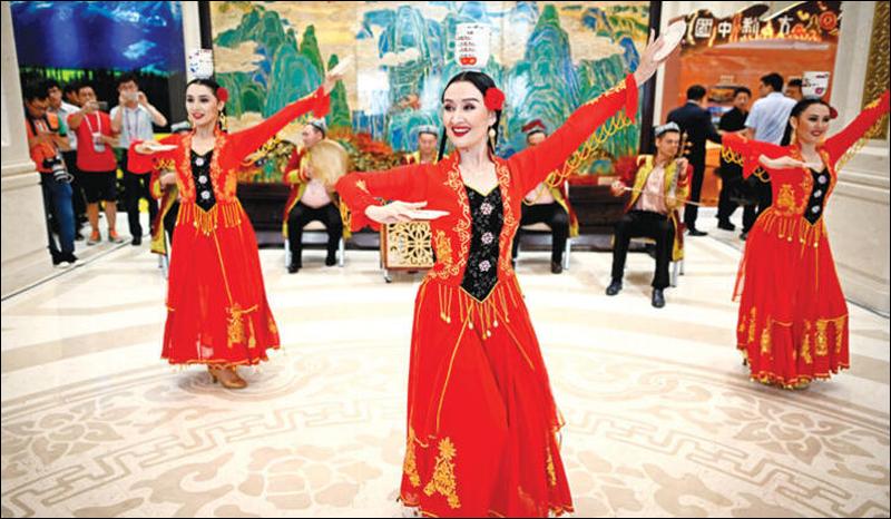 Chinese press conference with Uighur regional dancing