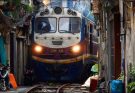 Seeing a train in the narrow streets of Hanoi